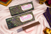 Two boxes of Balaji Kashmiri Lavender incense sticks on a soft pink fabric background.