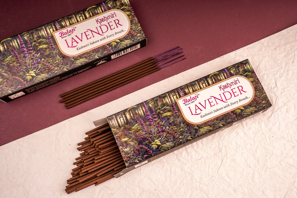 Two boxes of Balaji Lavender incense sticks on a textured surface with a maroon background