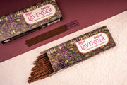 Two boxes of Balaji Lavender incense sticks on a textured surface with a maroon background