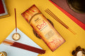 Incense stick packaging with incense sticks on a colorful background