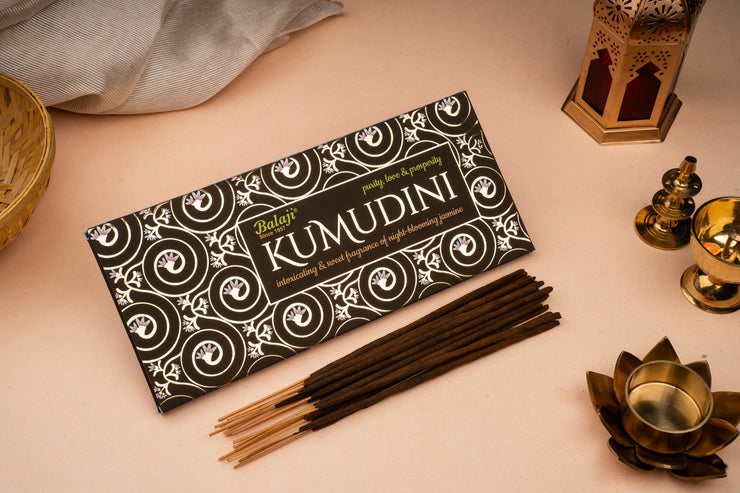 Kumudini incense sticks packaging with incense sticks on a light surface