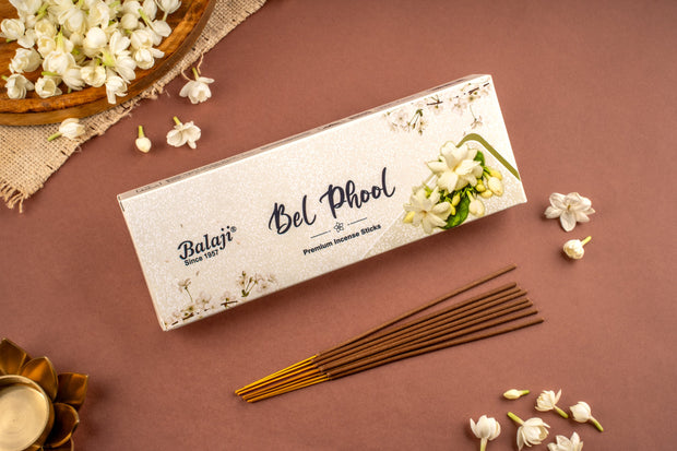Balaji Bel Phool incense sticks packaging with incense sticks on a brown background