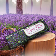 A box of Balaji Kashmiri Lavender incense sticks placed on a wooden surface with a background of lavender fields.