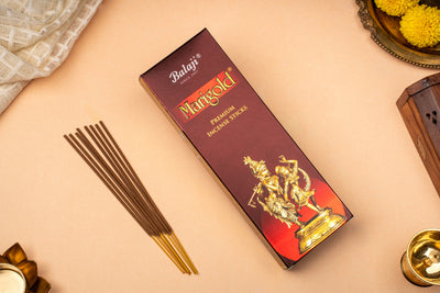 Balaji Meenakshi incense sticks packaging with incense sticks on a beige surface